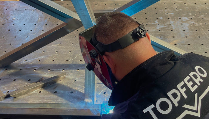 TopFero craftsperson manufacturing a metal structure